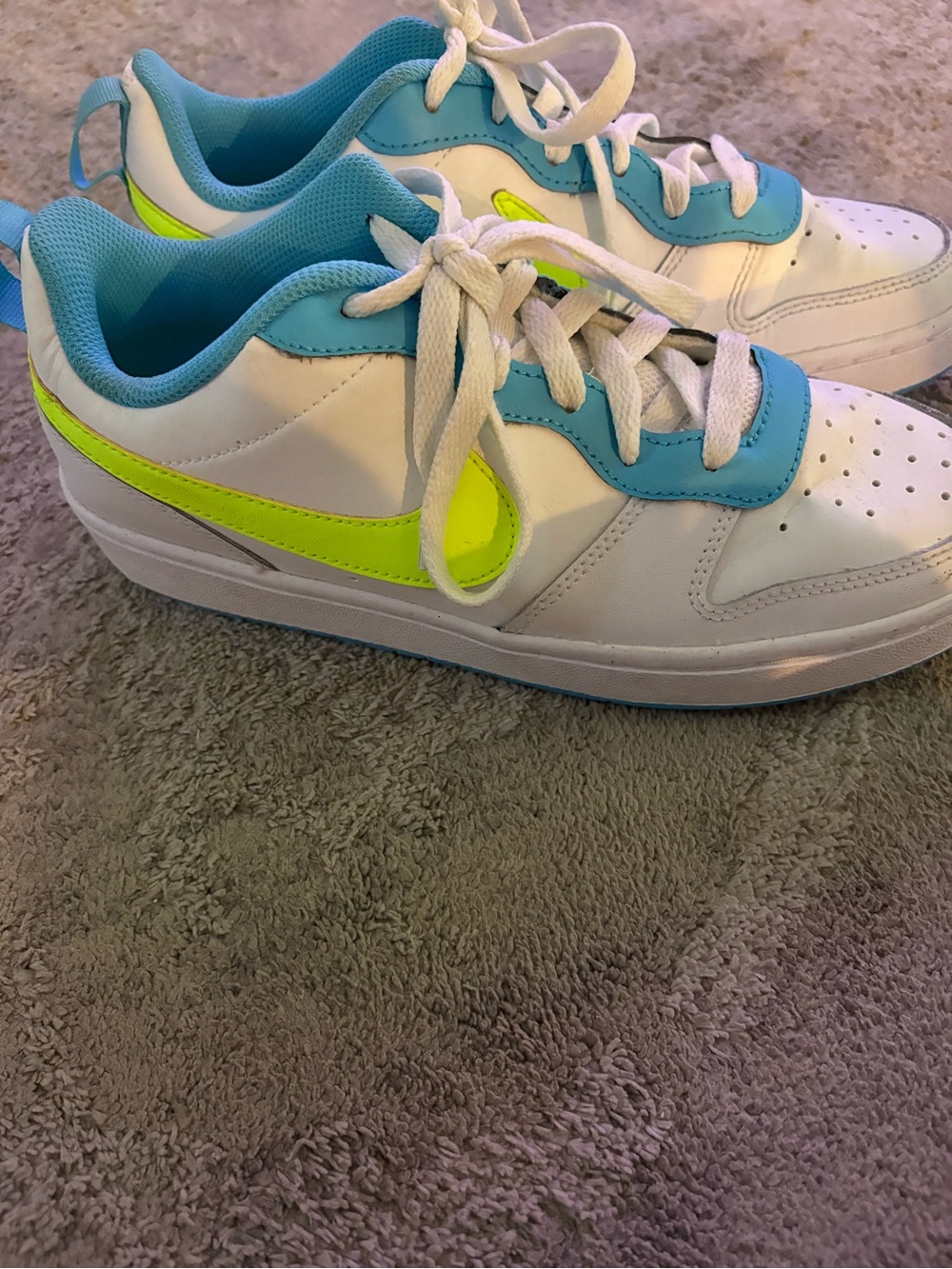 Nike Sneakers with Neon Yellow Swoosh and Blue Trim